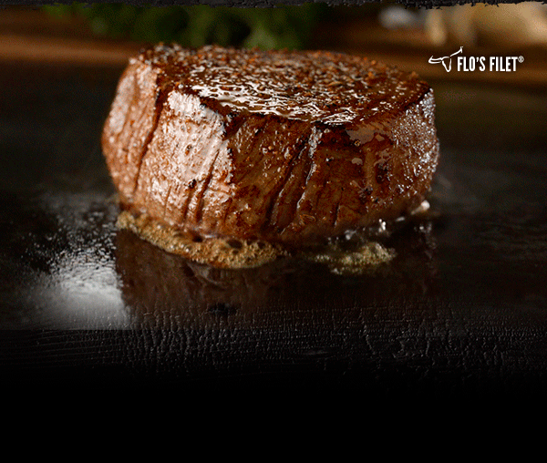 Flo's Filet sizzling on a grill.
